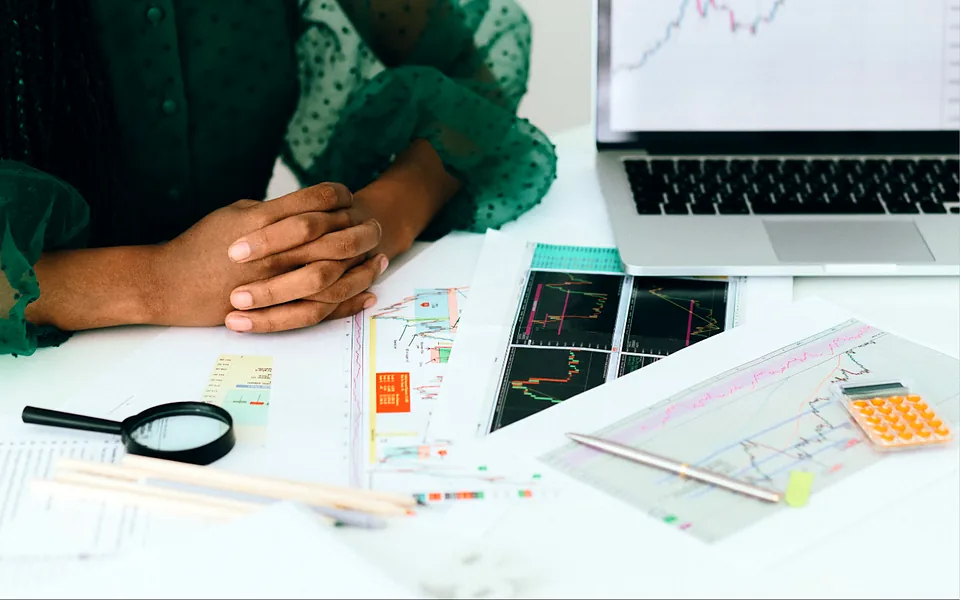 Two business owners reviewing financial reports together